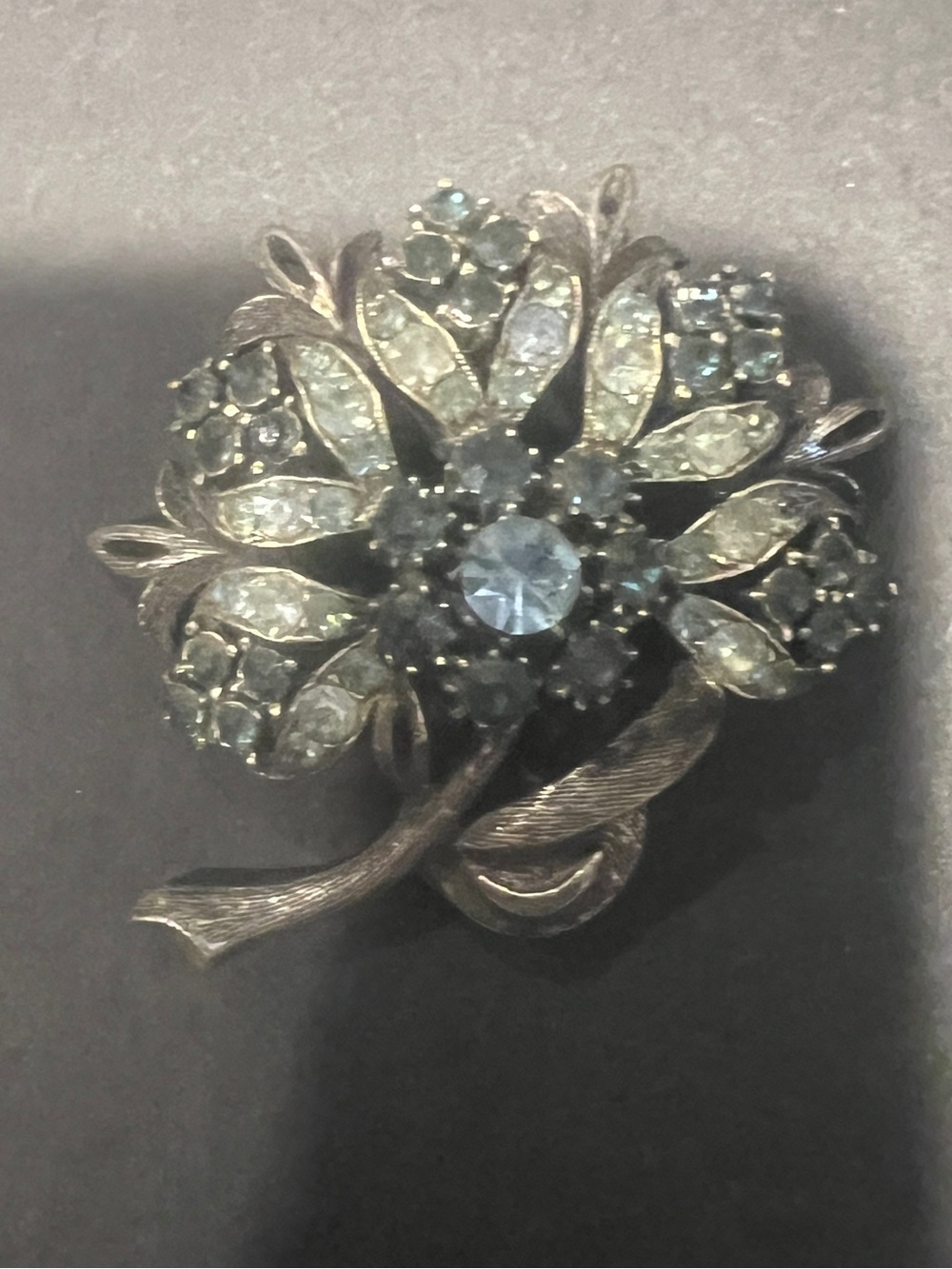 Silver Floral Brooch with Light Blue Crystal Accents